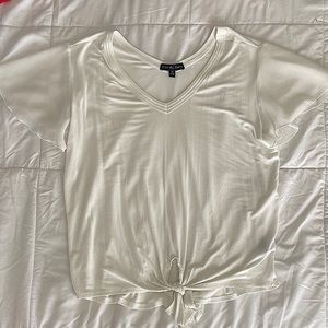 White tie front blouse with sheer sleeve details.